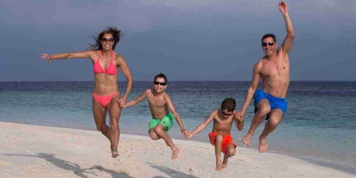 family on the beach coco palm dhuhi kolhu