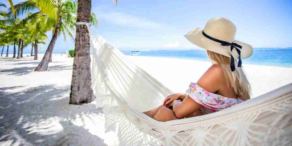 st regis le morne - woman enjoying hammock