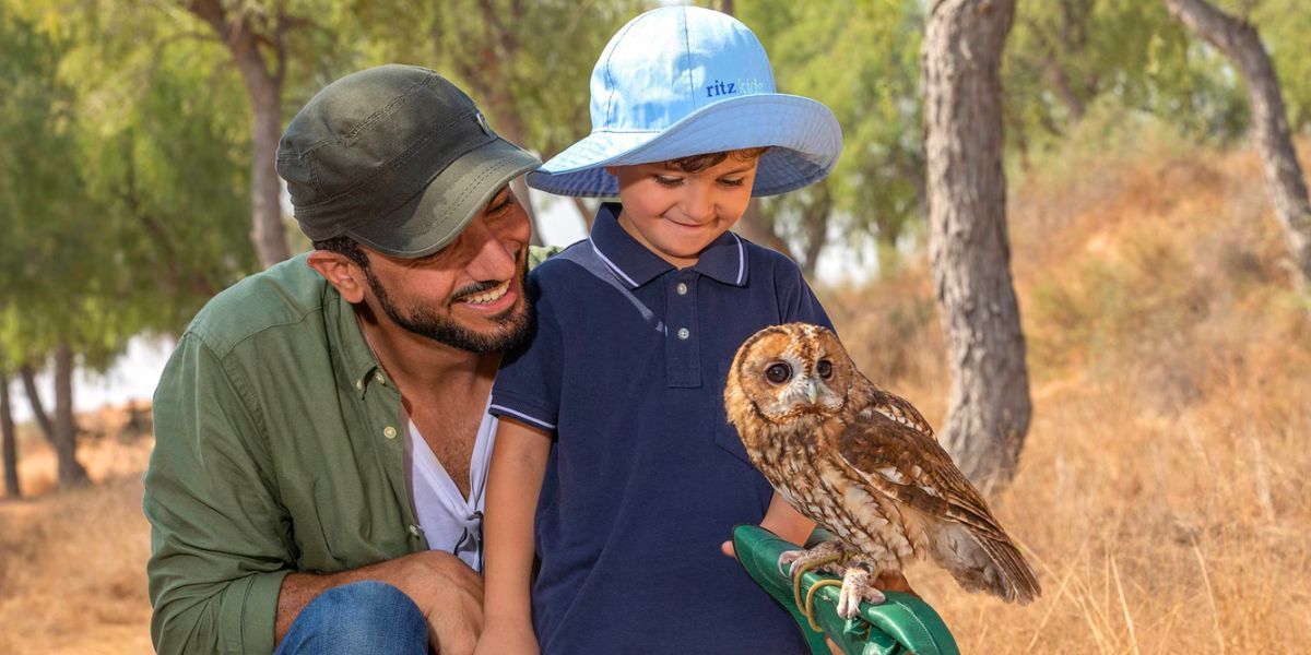 the ritz carlton al wadi desert_kids activities owl interaction